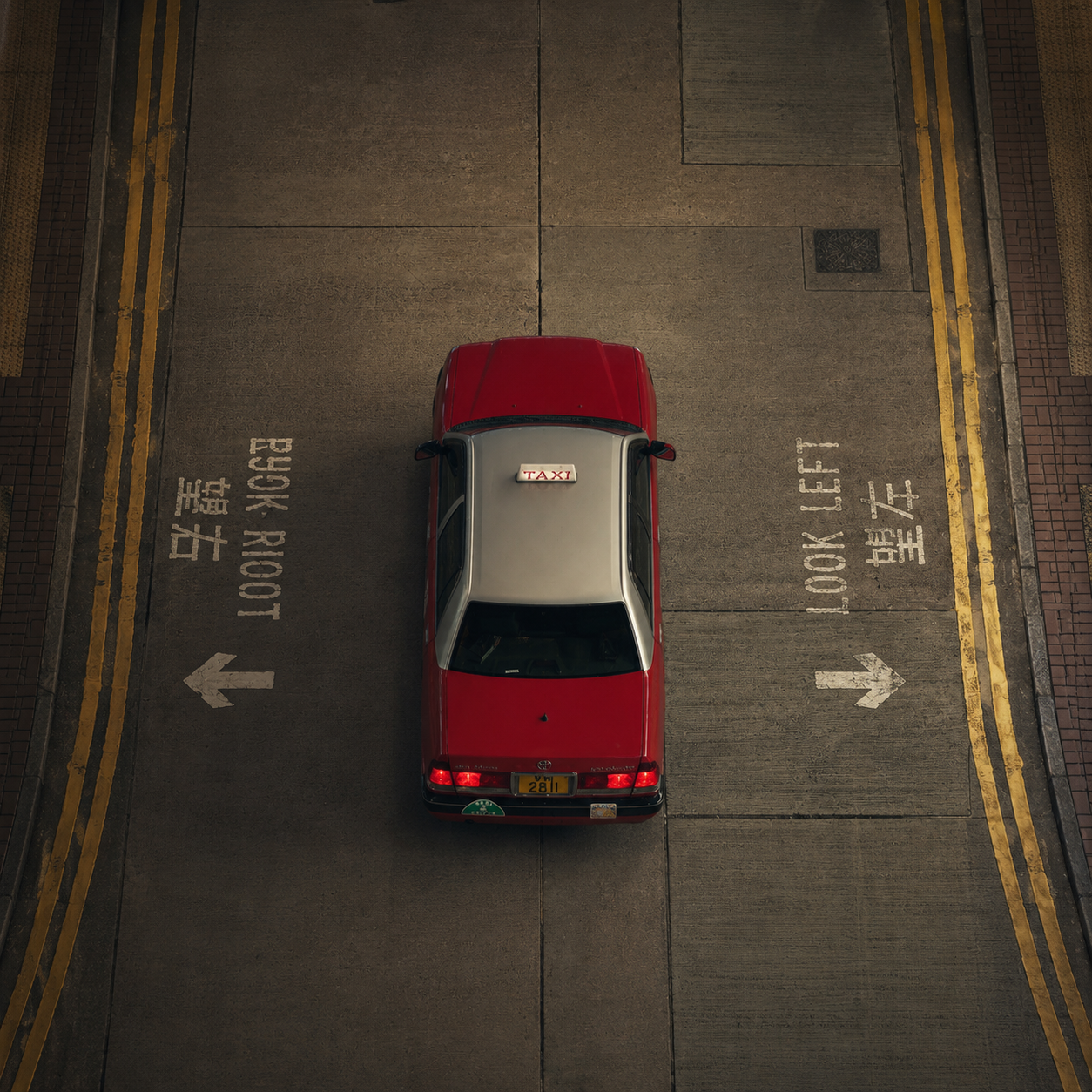 A red Hong Kong taxi seen from directly above
